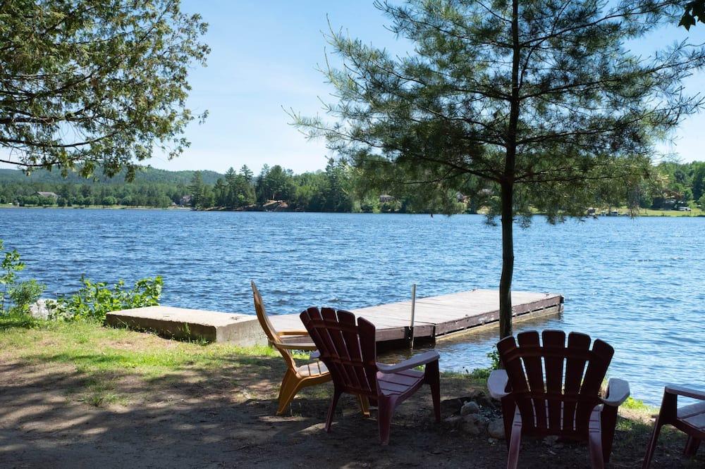 Bowman Ski Chalet | [# 1 The Fish] Cottage on the banks of the river.