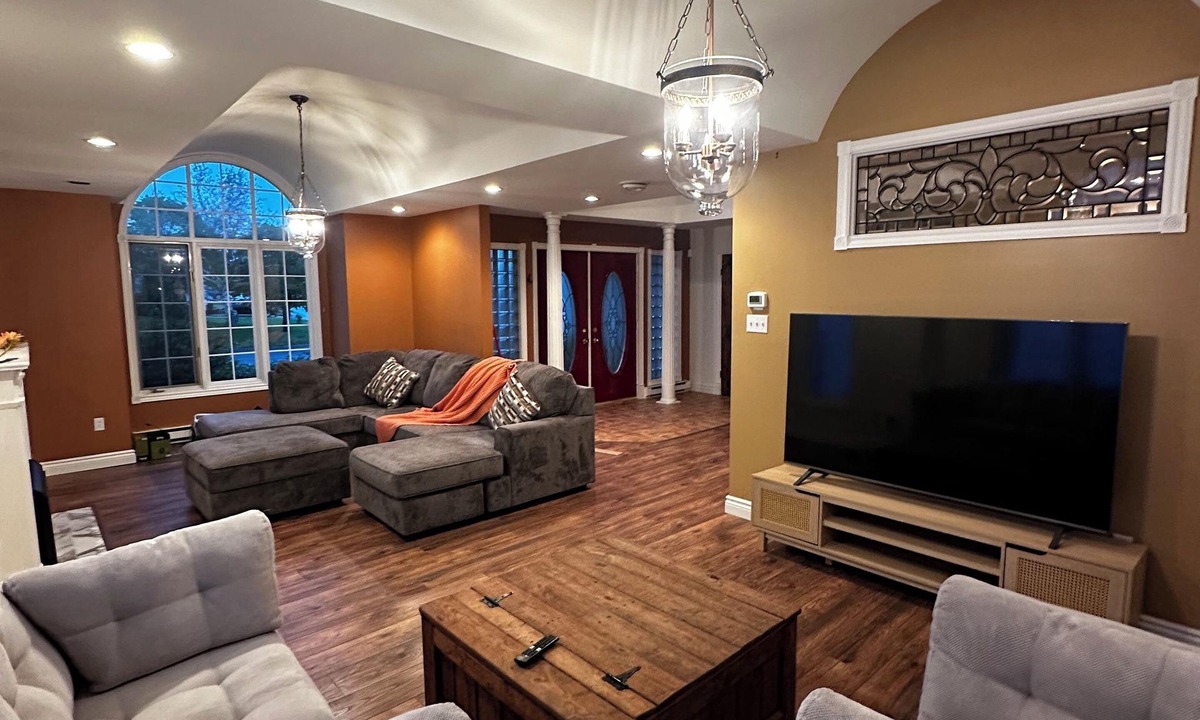 West End House | 5-bedroom oasis in central St. John's, featuring a deck overlooking lush greens.