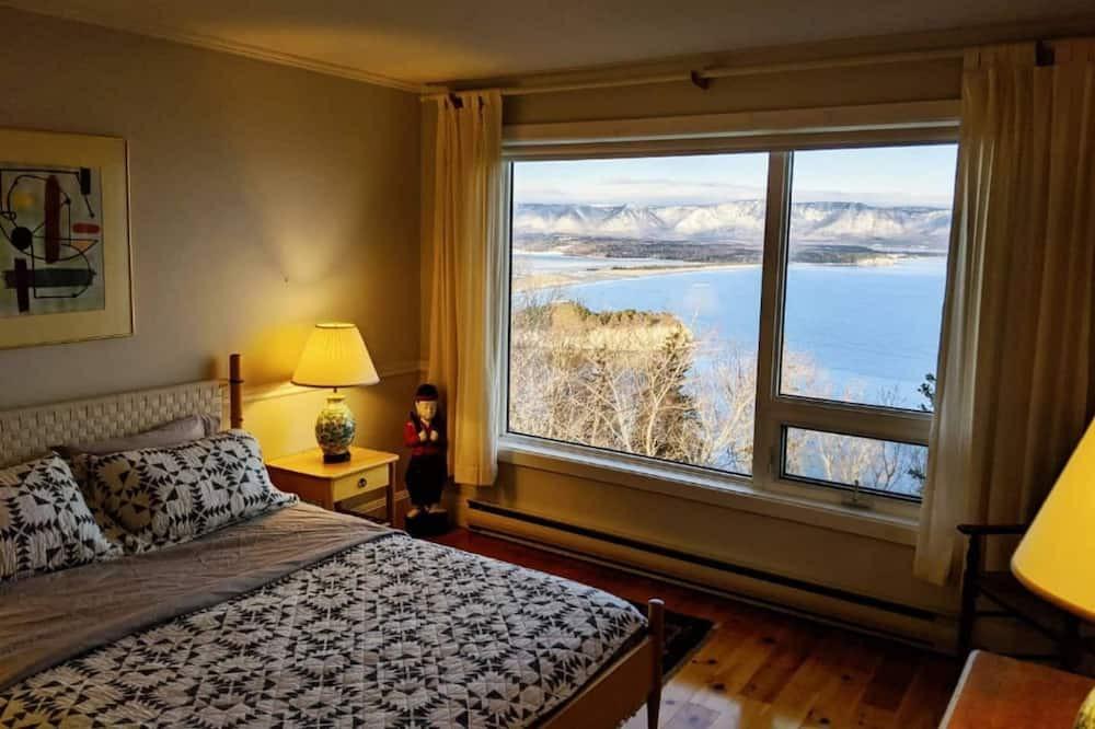 White Point Cottage | Enjoy the stunning views of the Cape Breton Highlands atop this cliffside estate