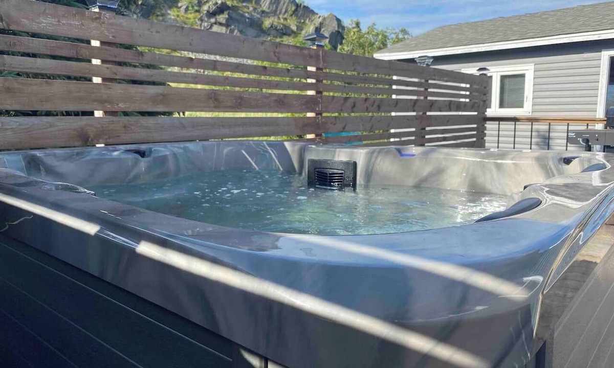 Carbonear Cottage | Escape to The Blue Bird – a cozy 2-bedroom cottage with hot tub and partial ocean views! Just 5 mins from Carbonear & 15 mins to Salmon Cove Sands.