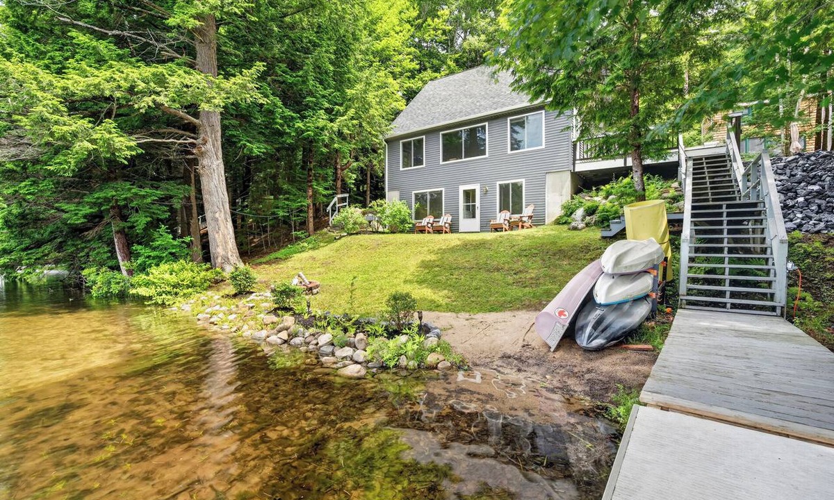 Belgrade Cabin | Lakeside Retreat- sleeps 14 with private dock and hot tub in Belgrade