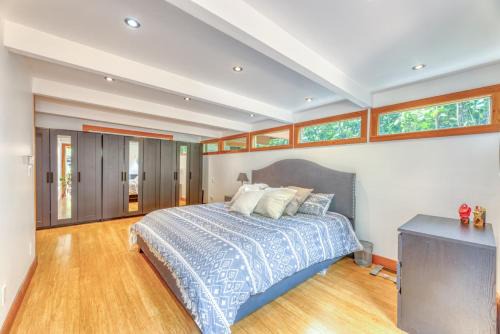 Upper Lonsdale House | Modern Mid-Century Home with Solarium, Deck, and Jacuzzi