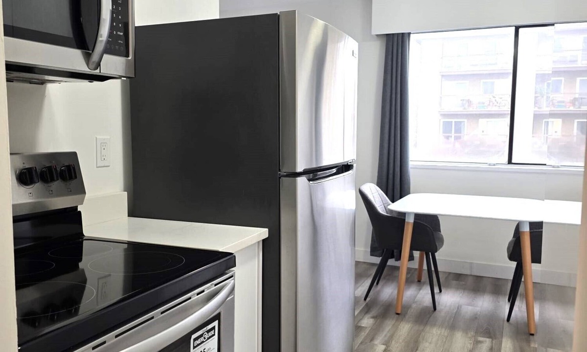 Lower Lonsdale Apartment | Modern & Top Floor 1 Bedroom Suite with Parking
