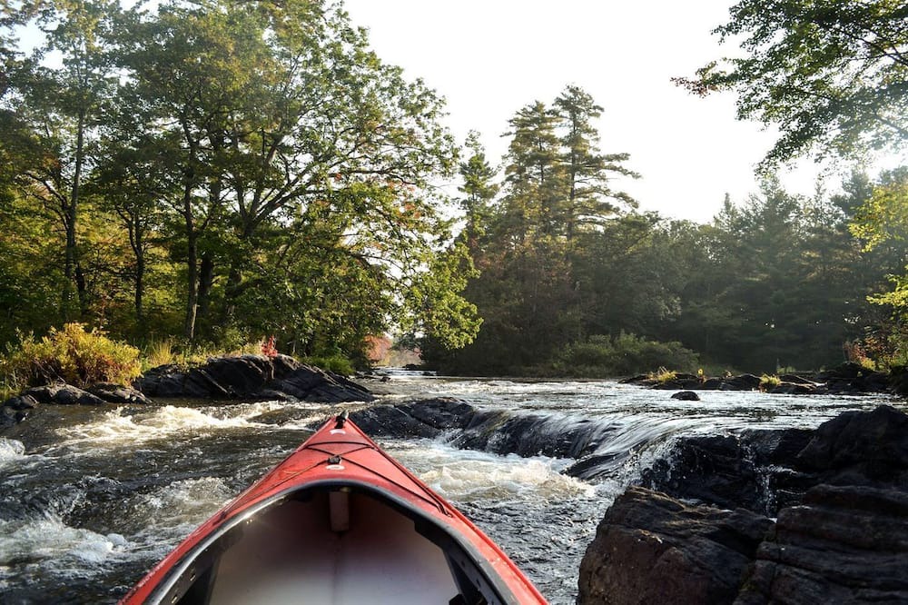 Stone Mills RV Rental | Rustic Waterfront Yurt on the Salmon River for a Peaceful Glamping Escape near Tamworth, Ontario