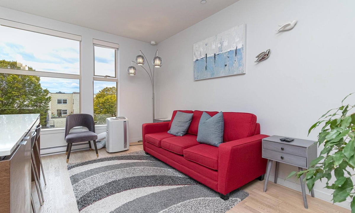Downtown Victoria Condo | Sleek Kitchen Island and Garden Views