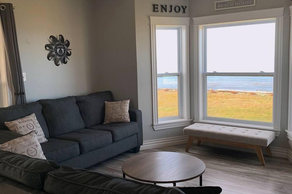 French Village House | Three Bedroom Home With Screened In Porch Only Steps Away From North Shore Beach