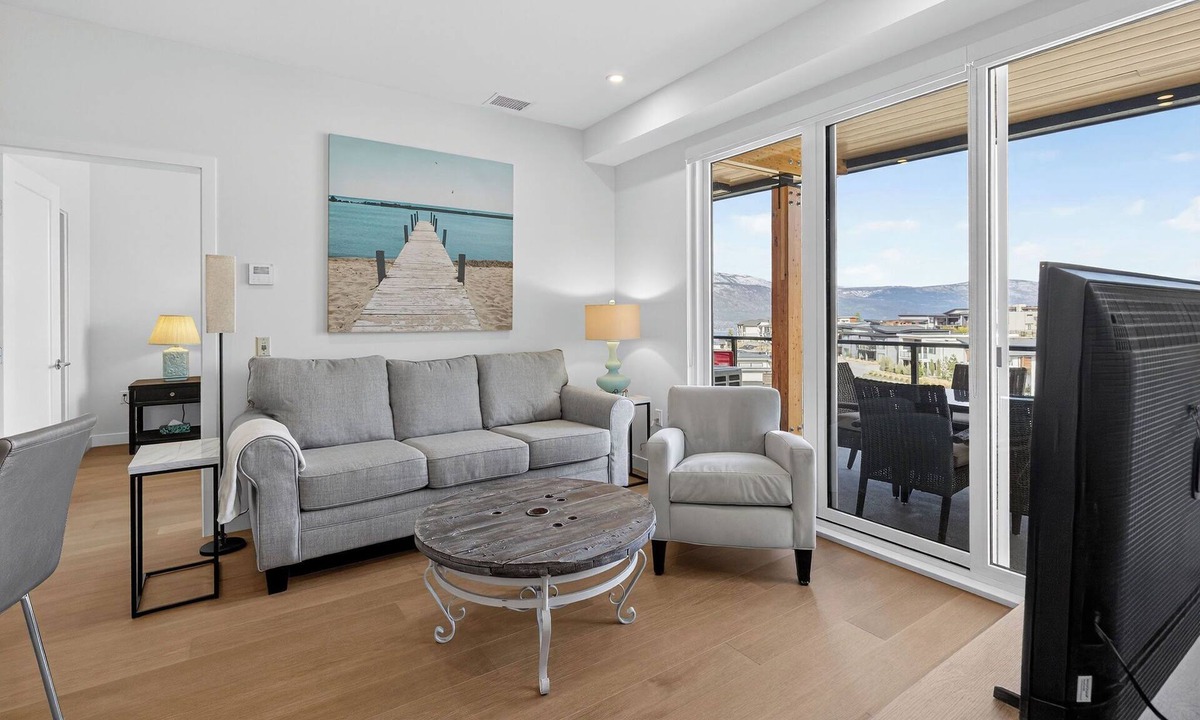 Central Okanagan Condo | Welcome to Zara at Lakestone! A premier lakeside community for a peaceful escape with pickleball courts, gym, & sauna. Enjoy lake views, nearby wineries, and modern comfort with a chef’s kitchen, queen bedroom, bunk room, and workspace.