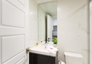 Serene and Styled Little Italy Studio full bath by Den Stays