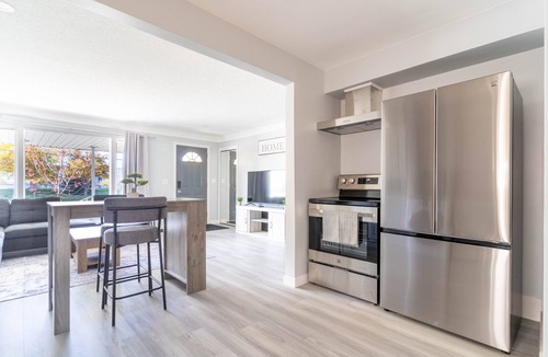 Windsor House | Bright 2 beds, 1 bath home with large yard and close to Airport and Shopping