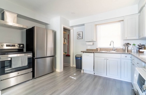 Windsor House | Bright 2 beds, 1 bath home with large yard and close to Airport and Shopping