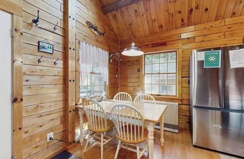 Beaver Cove House | Cozy cabin with covered porch, firepit, grill, fireplace, & washer/dryer