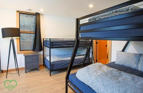 Historic Downtown Fernie Apartment | Downtown Loft with Rooftop Hot Tub by StayIn