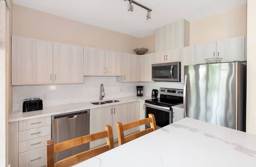 Village North Hotel | Enjoy Luxury Living & Ideal Village Location | Pool & Hot Tub