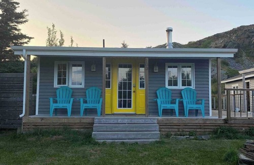 Carbonear Cottage | Escape to The Blue Bird – a cozy 2-bedroom cottage with hot tub and partial ocean views! Just 5 mins from Carbonear & 15 mins to Salmon Cove Sands.
