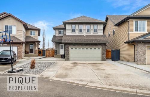 Northwest Edmonton Apartment | Game Night Retreat - HotTub - AC - FireTable - BBQ - Kingbed
