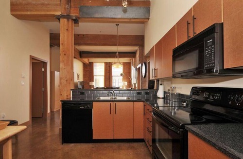 Downtown Victoria Condo | Historic Loft w/Exposed Brick & Timber Beams