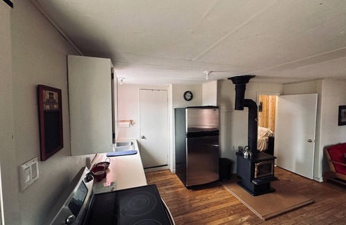 La Malbaie Cabin | Horse shelter. Located on a ranch with a view of the horses. Pets allowed.