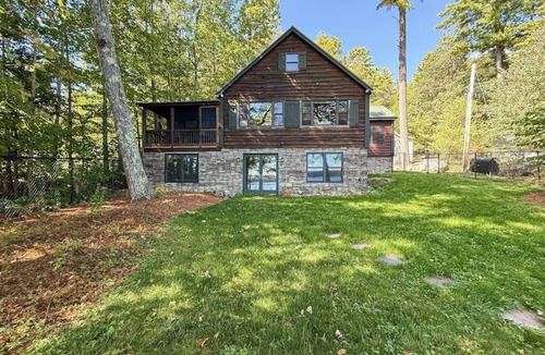 Rome House | Inviting Lakeside Home with direct dock access, patio seating, and gas fireplace