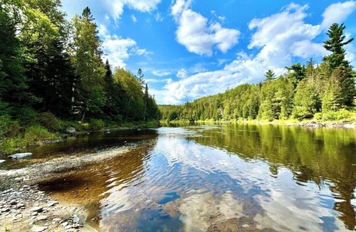 Fort Kent Mills RV Rental | Junction 19 & Co. Riverfront Campsite #1 - Cozy & Tranquil - In Town & On Trails