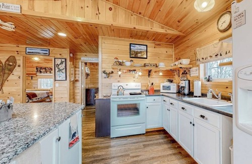 Greenville Junction House | Lake-view two-story home with beach access, wood stove, grill, W/D, & fast WiFi