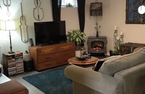 Rosemount Apartment | Large private fenced yard with guest patio, fire pit and surrounding gardens.