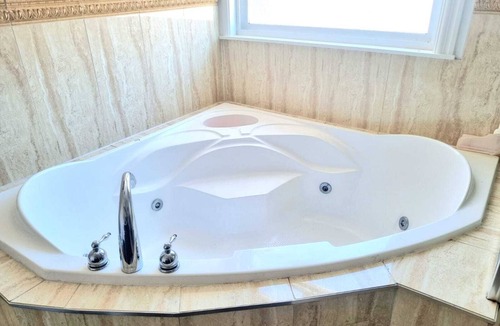 Newton Apartment | Luxurious Master Bedroom Suite with In-suite Bathroom with Jacuzzi