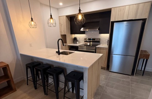 Plateau Apartment | Modern 1BD Suite at Le Prisme w/Indoor Pool, Gym & Yoga Studio