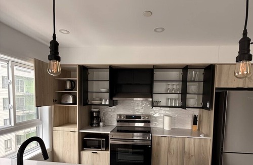 Plateau Apartment | Modern 1BD Suite at Le Prisme w/Private Balcony, Pool, Gym & Yoga Studio