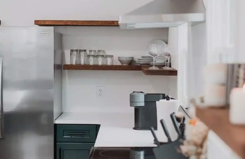 Fletcher Place Apartment | Modern Downtown Indy Apt - King Bed, Patio & Cute Flower Shop Below