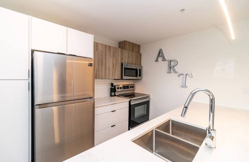 North End Apartment | Modern North End 1BD Suite w/Gym, On-Site Cinema & Workspace