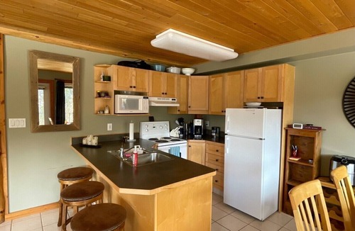 Okanagan-Similkameen Condo | Morning sun, private deck, hot tub, cozy living space, serenity!
