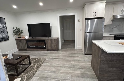 Surrey Newton Apartment | Private 1BR near KPU, SMH, Transit, shops including wifi/parking/workspace!