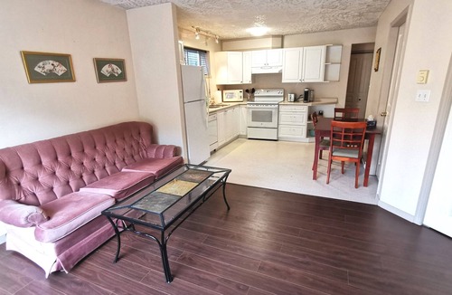 Saanich West House | Private 2 Bedroom Suite with one bed and a crib