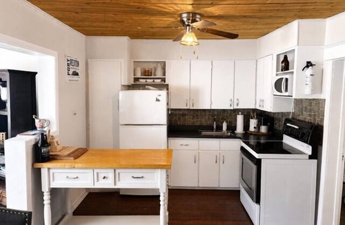 Port Rexton House | Relax at The Bonavista Branch House - Port Rexton, a cozy 2BR retreat near Skerwink Trail and Trailway. Once home to railway engineers and conductors, this updated cottage offers firepit evenings, local dining, Port Rexton Brewing, and Nfld charm.