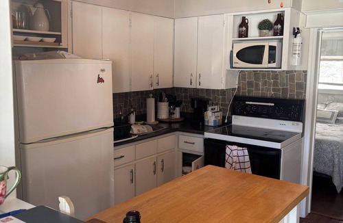 Port Rexton House | Relax at The Bonavista Branch House - Port Rexton, a cozy 2BR retreat near Skerwink Trail and Trailway. Once home to railway engineers and conductors, this updated cottage offers firepit evenings, local dining, Port Rexton Brewing, and Nfld charm.