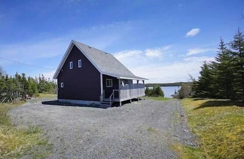 Terra Nova House | Rhodies Pondside It's ideal for guests looking to unwind, enjoy scenic views, and experience a quiet getaway.