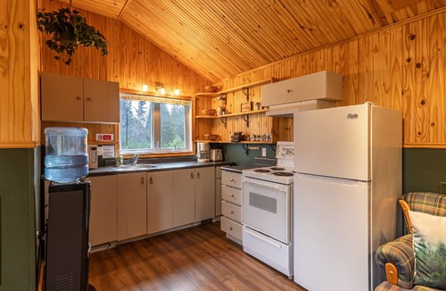 Lac-Etchemin Ski Chalet | Riverside chalet with fire pit, indoor fireplace, perfect for nature retreats.