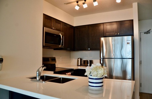 Toronto Entertainment District Condo | Roger’s Center- Downtown large two bedroom + den facing waterfront by CN Tower,