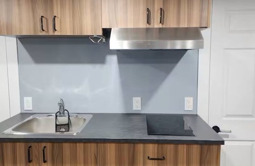 Mount Pearl House | Salt and Spruce private 1 bedroom suite with double bed, kitchen, and laundry