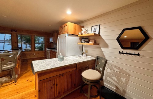 Steuben Cabin | Shoreline solitude, rustic, nestled between evergreens and Pigeon Hill Bay