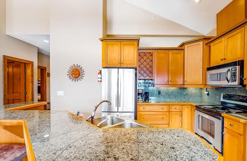 Big White Ski Resort House | Ski-in/ski-out townhouse right next to lifts - private hot tub, fast WiFi & W/D