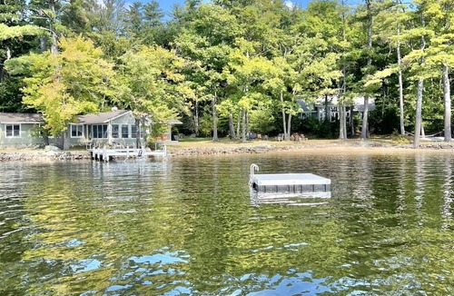 Harrison Cottage | SLEEPS 15 WITH A PRIVATE SANDY BEACH ON LONG LAKE.