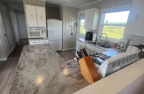 Queens County Cottage | Spacious 3 bedroom waterfront cottage. Only 75 feet from your own private beach!