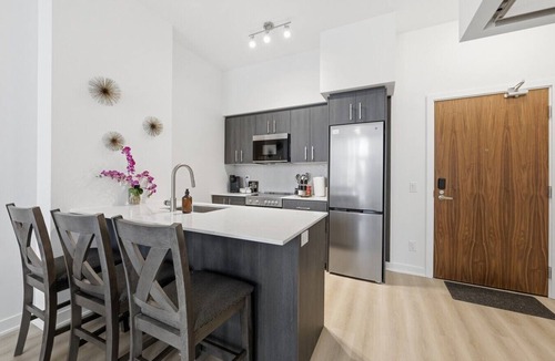 Kitchener Apartment | Stylish 2BR in Station Park | Private Patio + Spa, Gym & Bowling