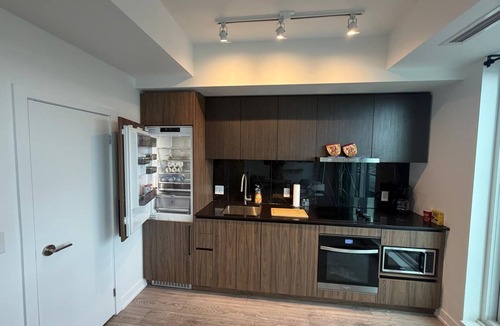North York Condo | Sun-Drenched Penthouse Retreat with Gym & Parking