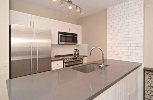 Village North Condo | Superb Village location, comfortably renovated and one FREE parking stall