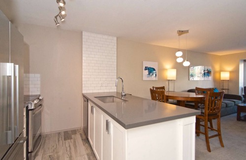 Village North Condo | Superb Village location, comfortably renovated and one FREE parking stall