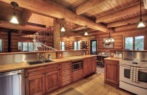 La Minerve Cottage | Waterfront Log Cottage with Hot Tub and Sauna