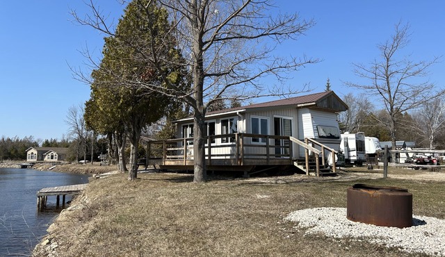 #0 Enjoy a waterfront view from your own trailer with a deck & sunroom