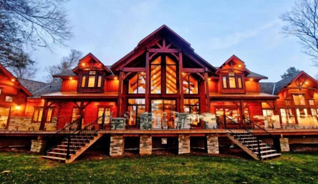 Beautiful Custom Log Home nestled on 300 ft beach front